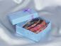 Preview: Three magenta glitter bangles, presented in a pretty gift box made of sturdy paper – decorated with a satin ribbon and a rosette